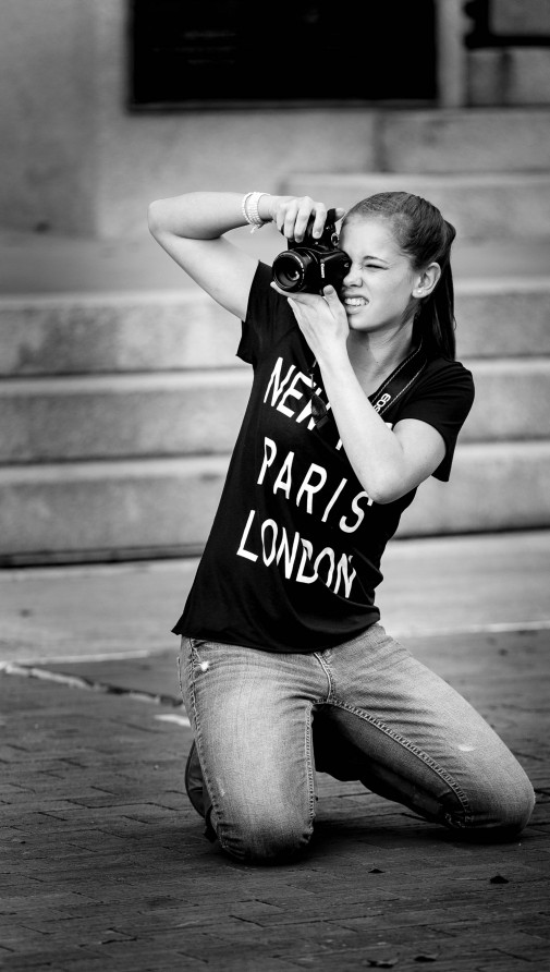 teen-caucasian-female-holding-camera-and-taking-shot-near-ec-courhouse