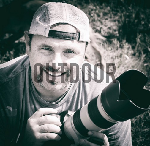 Franklin-ford-mid-40s-male-holding-up-camera-with-text-outdoor