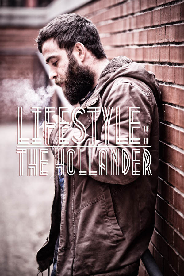 mid-30s-caucasian-male-with-beard-smoking-cigar-and-text-stating-lifestyle-the-hollander-in-middle-of-screen