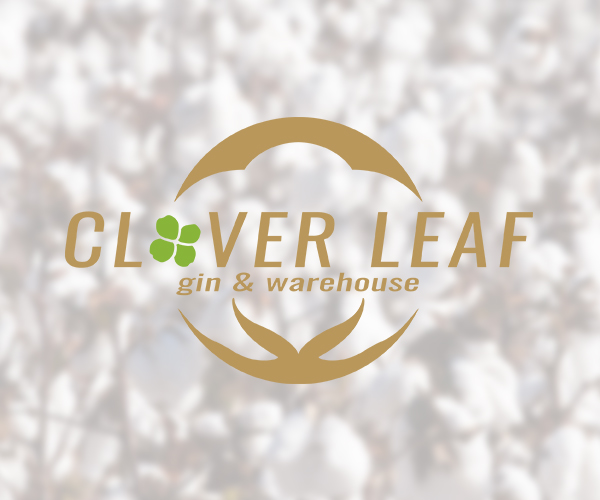 clover-leaf-gin-and-warehouse-logo-with-cotton-boll-under-and-cotton-field-in-background