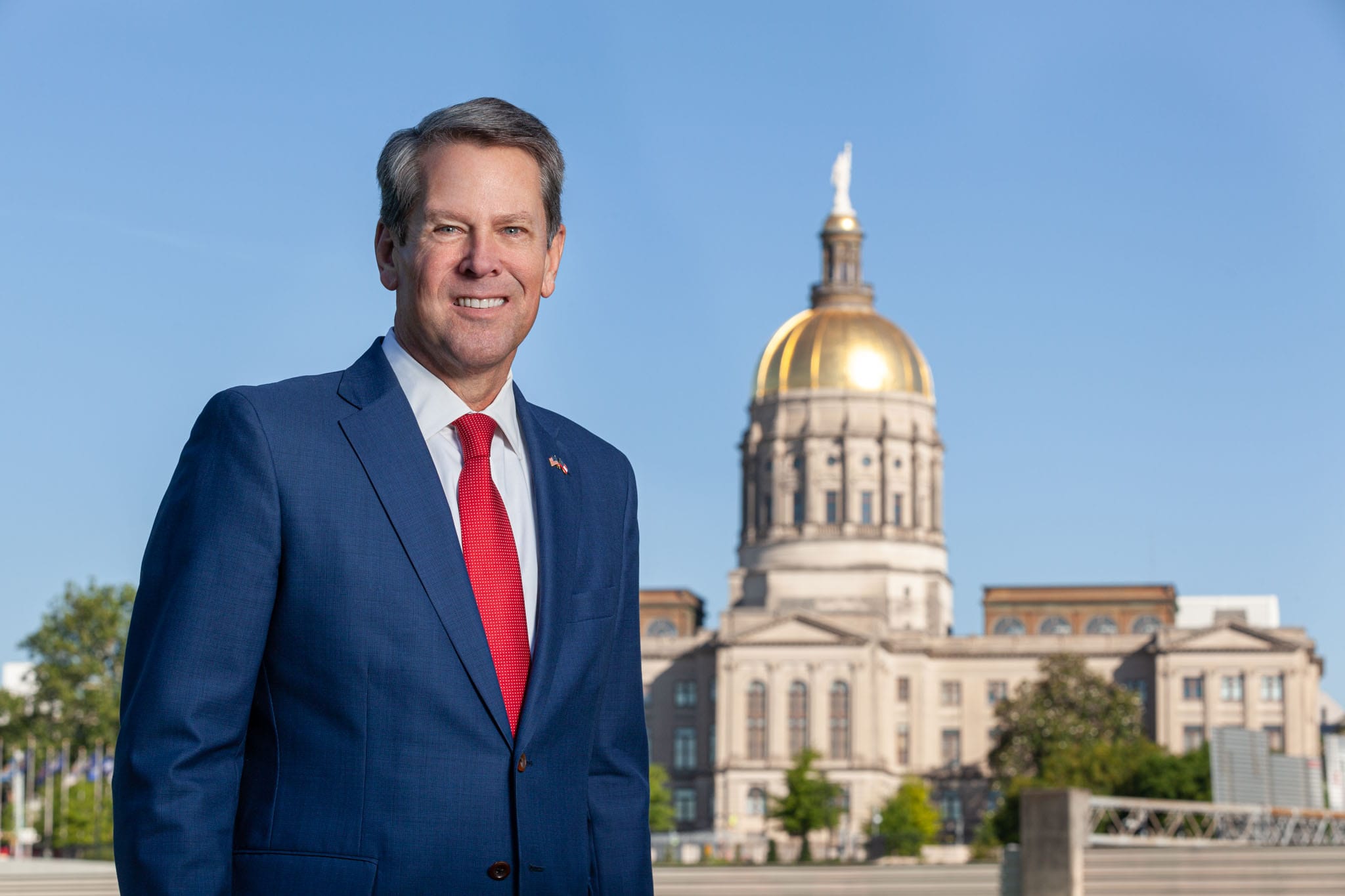 Georgia-Governor-Brian-Kemp-standing-in-front-of-the-Georgia-State-Capitol.