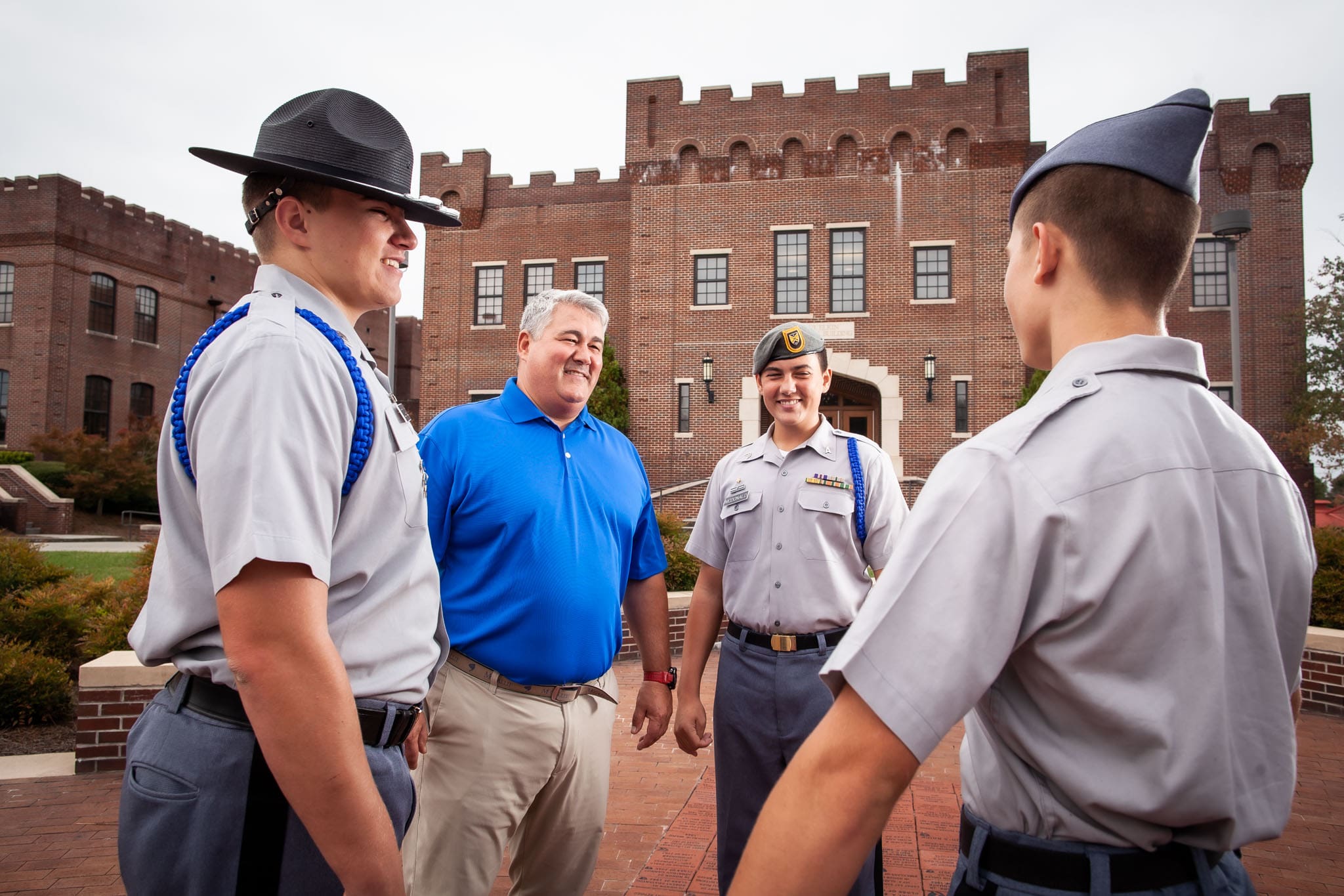 Lauren-McDonald-his-son-and-two-other-Riverside-Military-Academy-cadets-in-a-circle-talking.