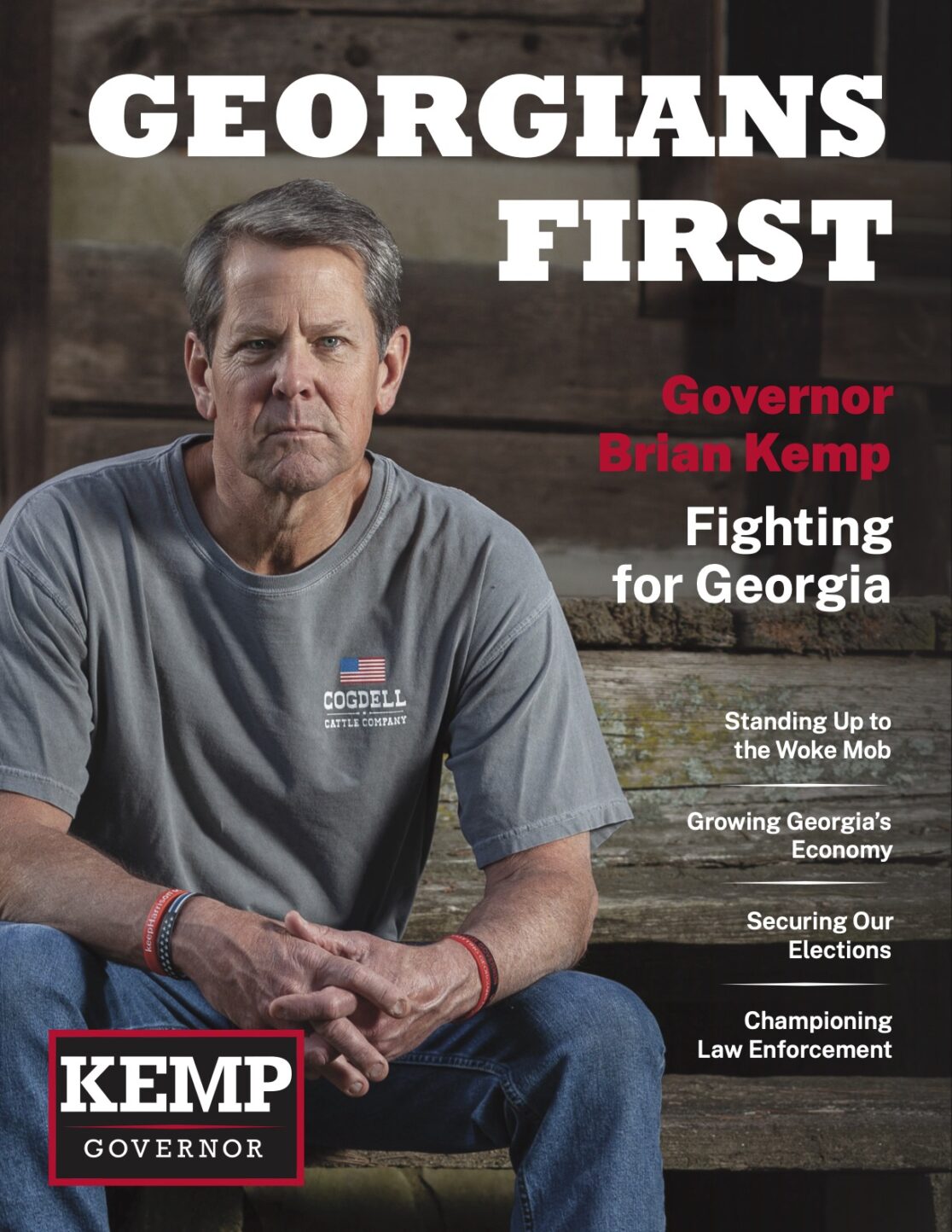 Elected-Georiga-governor-Brain-Kemp-gazing-foward-whilst-sitting-on-stairs-of-log-cabin.