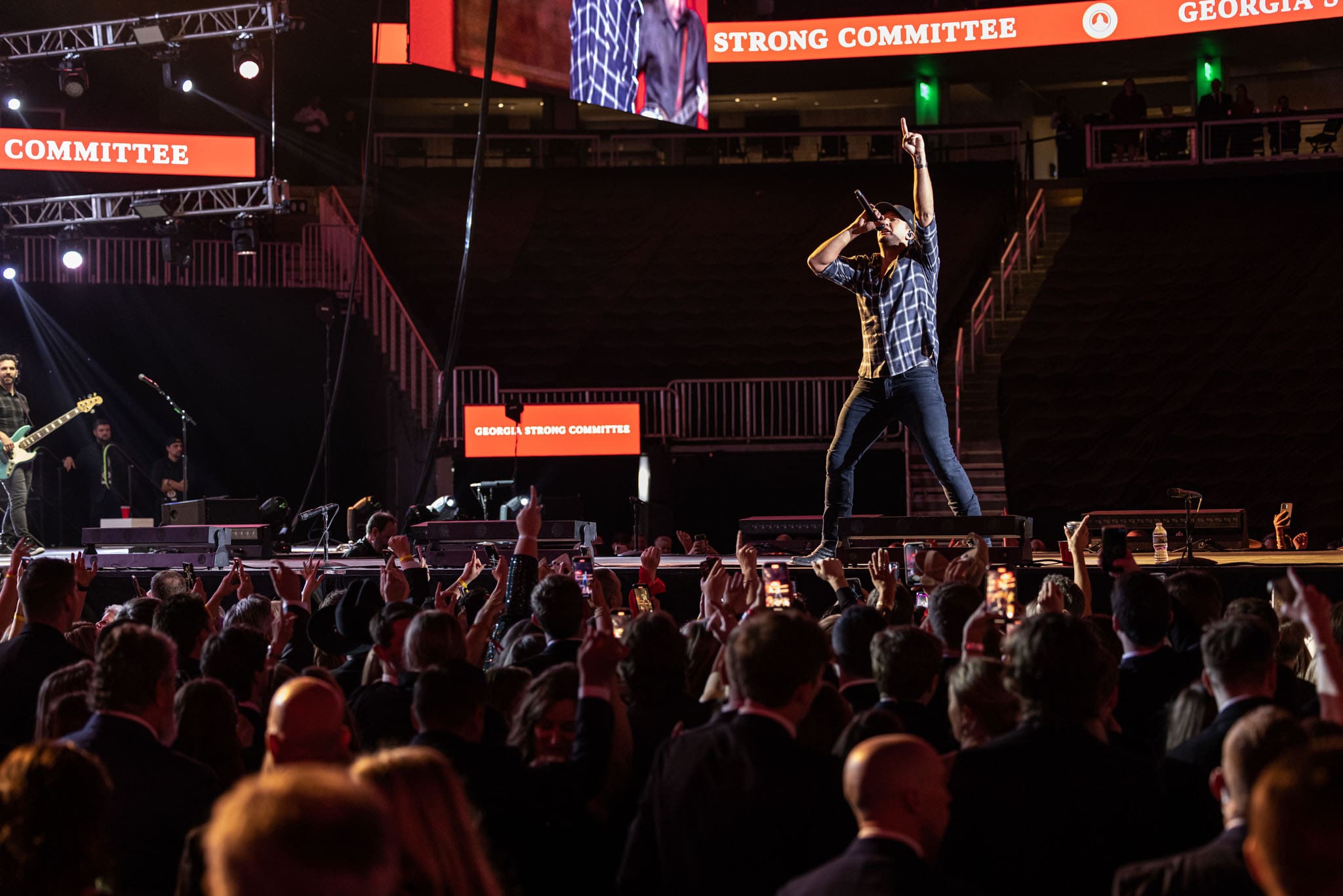 Luke-bryan-performing-at-governor-kemps-inauguration-gala-at-state-farm-arena-atlanta-with-crowd-in-foreground